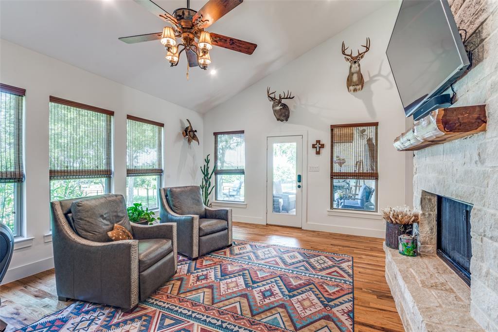 626 Lone Tree Road Nevada, TX 75173 - Photo 16 of 40 a living room with furniture and a fireplace