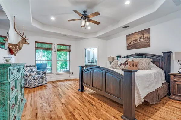 a bedroom with a bed and a chair