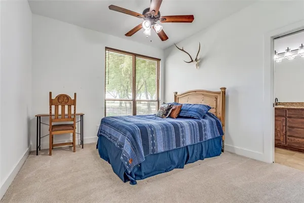 a bedroom with a bed dresser and a window
