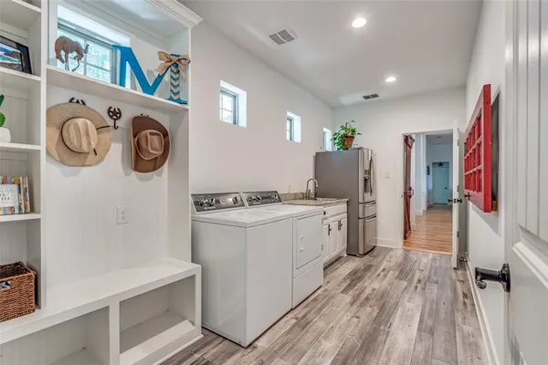 a view of storage and utility room with washer and dryer