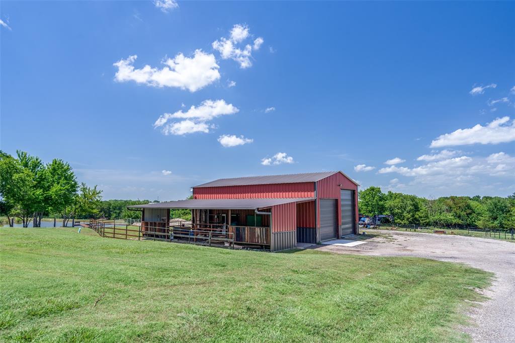 626 Lone Tree Road Nevada, TX 75173 - Photo 34 of 40 a view of a house with a yard