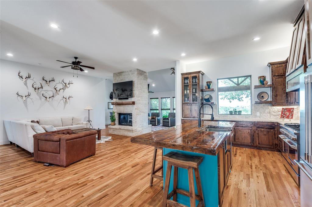 626 Lone Tree Road Nevada, TX 75173 - Photo 6 of 40 a living room with furniture and a wooden floor