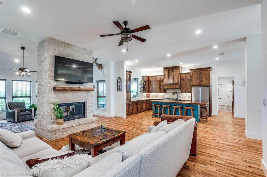 626 Lone Tree Road Nevada, TX 75173 - Photo 9 of 40 a living room with furniture fireplace and flat screen tv