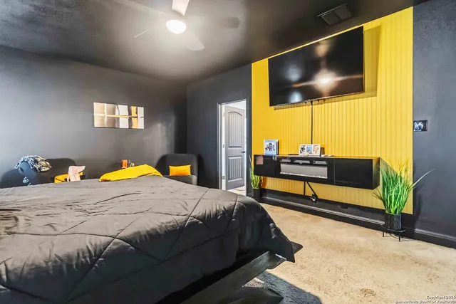 a bedroom with a bed and couch