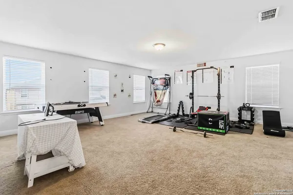 a view of a big room with gym equipment