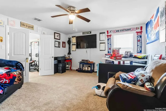 a room with furniture toys and a flat screen tv