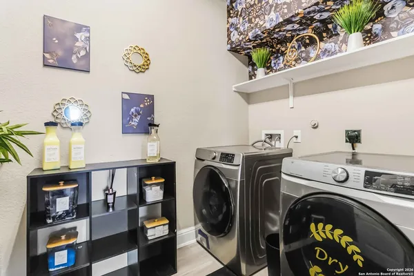 a utility room with dryer and washer