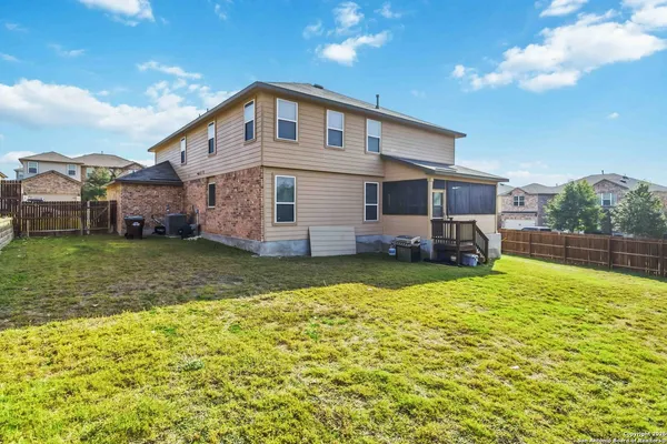 a front view of house with yard and swimming pool