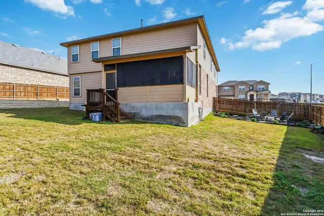 a house view with swimming pool in front of it