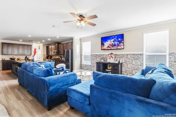 a living room with fireplace furniture and a flat screen tv