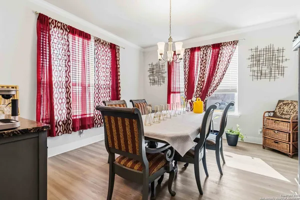 a view of a dining room with furniture window and wooden floor