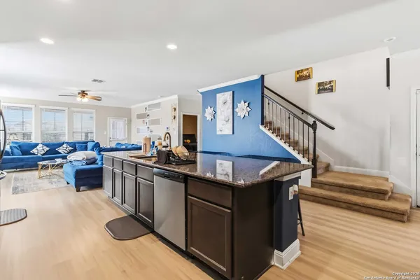 a kitchen with stainless steel appliances granite countertop a stove and a sink