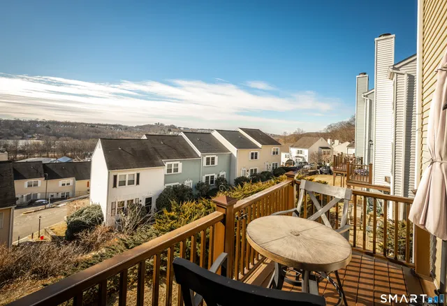 a view of a balcony with chairs