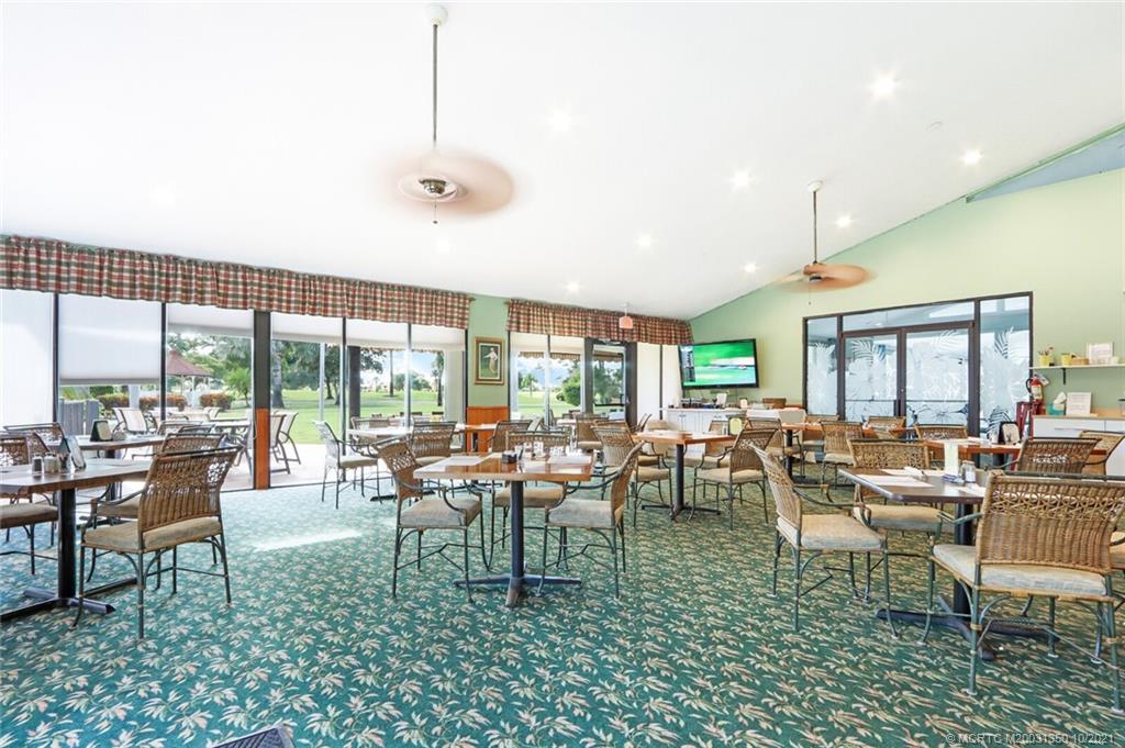 5443 Southeast Miles Grant Road, Unit D205 Stuart, FL 34997 - Photo 37 of 44 Tavern with Patio Seating