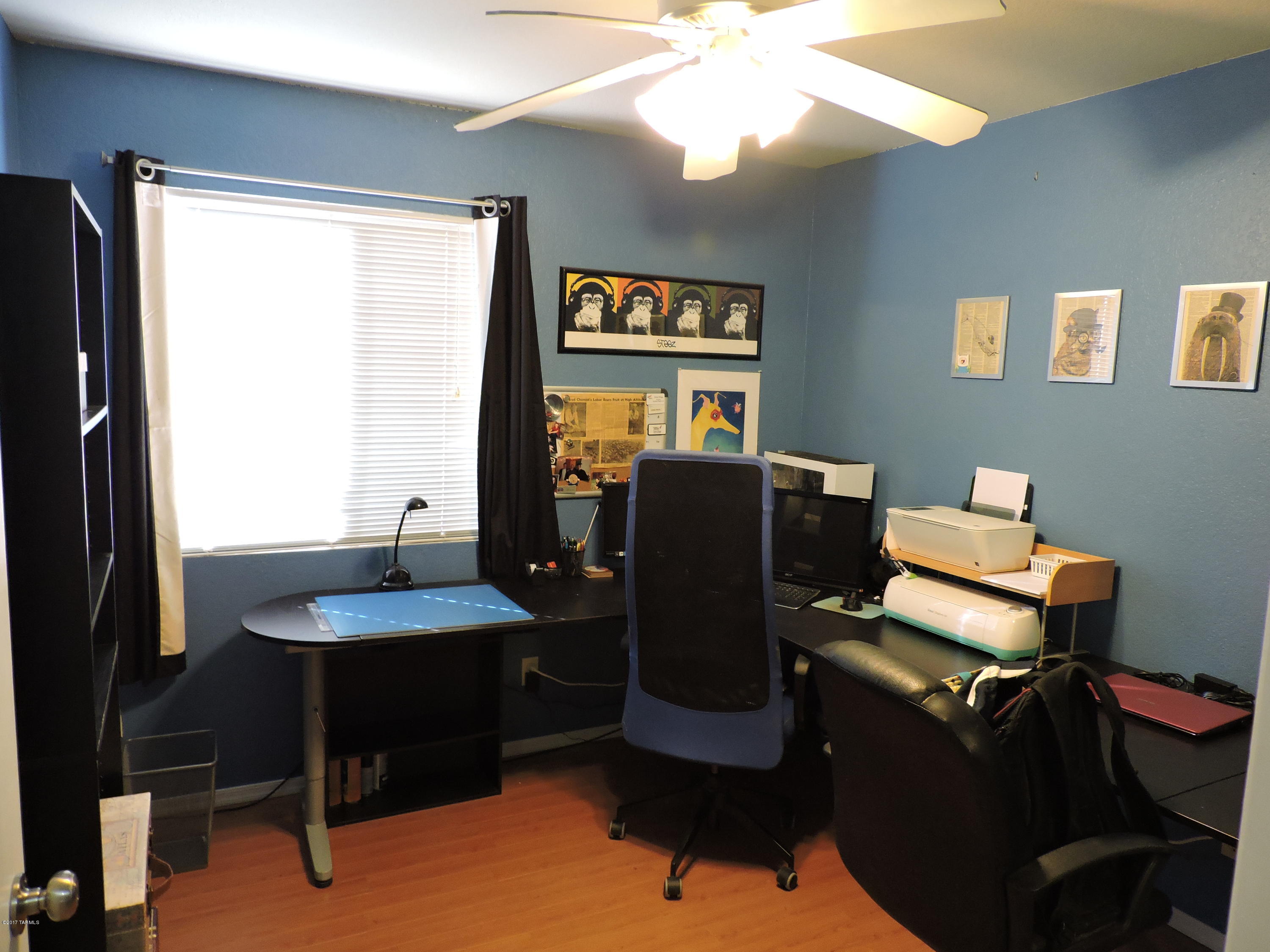 2709 West Firebrook Road Tucson, AZ 85741 - Photo 4 of 17 a view of a workspace with furniture and a window