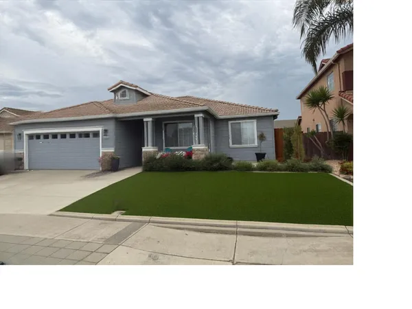 a house view with a garden space