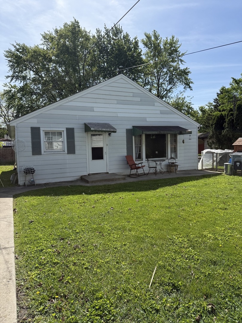 3035 Peoria Street Steger, IL 60475 - Photo 2 of 19 a front view of house with yard and outdoor seating