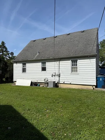 a backyard of a house with lots of green space