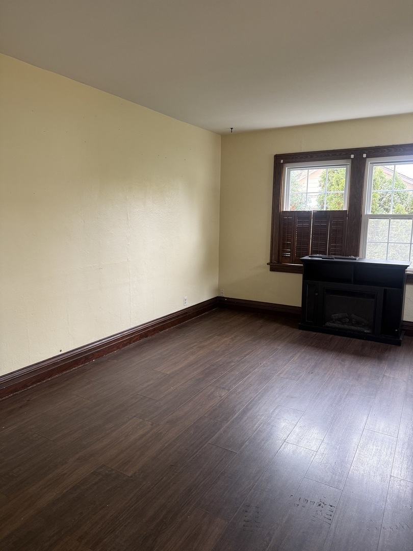 3035 Peoria Street Steger, IL 60475 - Photo 5 of 19 a view of room with wooden floor and windows