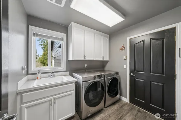 a utility room with dryer and washer