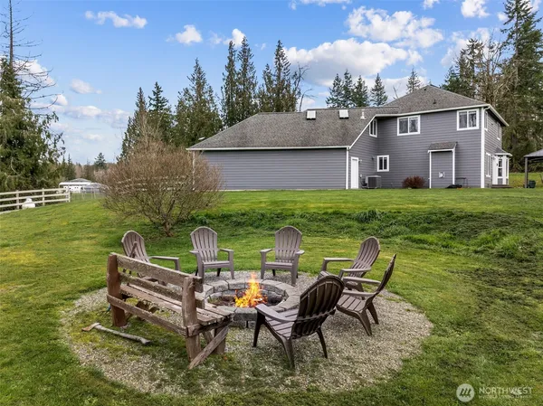 a view of a house with backyard porch and garden