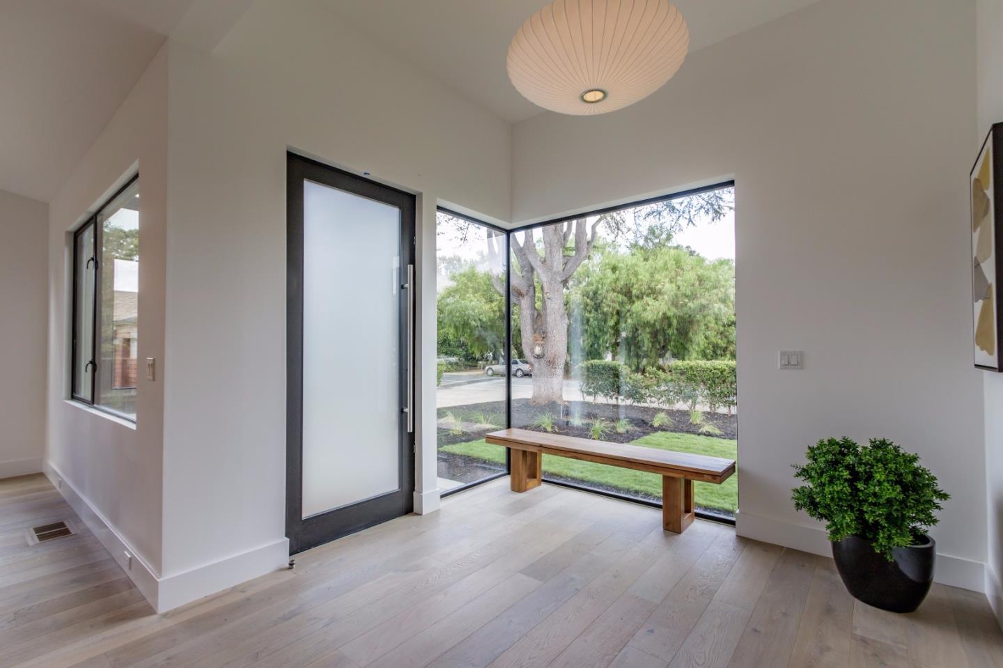 728 Covington Road Los Altos, CA 94024 - Photo 3 of 37 a view of a room with wooden floor and a potted plant