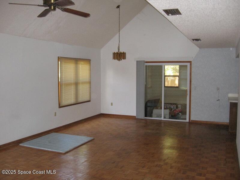 120 Cortez Street Melbourne Beach, FL 32951 - Photo 2 of 7 an empty room with windows