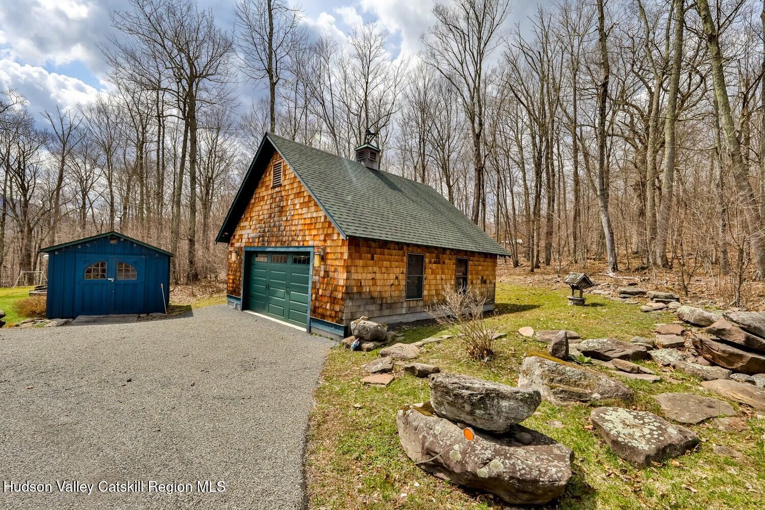 15 Hardwood Road West Kill, NY 12492 - Photo 29 of 53 a backyard of a house with table and chairs