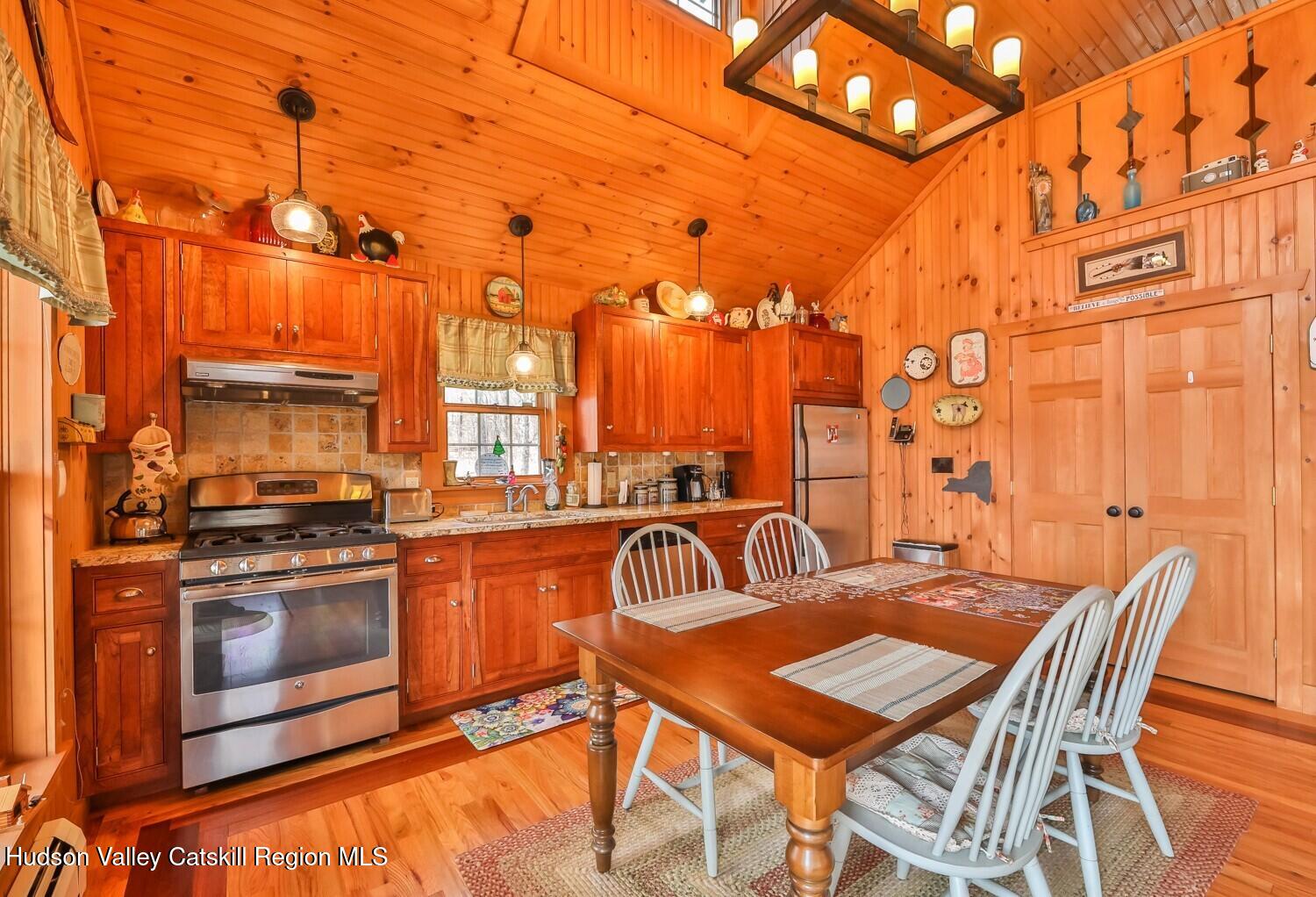 15 Hardwood Road West Kill, NY 12492 - Photo 35 of 53 a view of a city from a dining room with furniture and chandelier