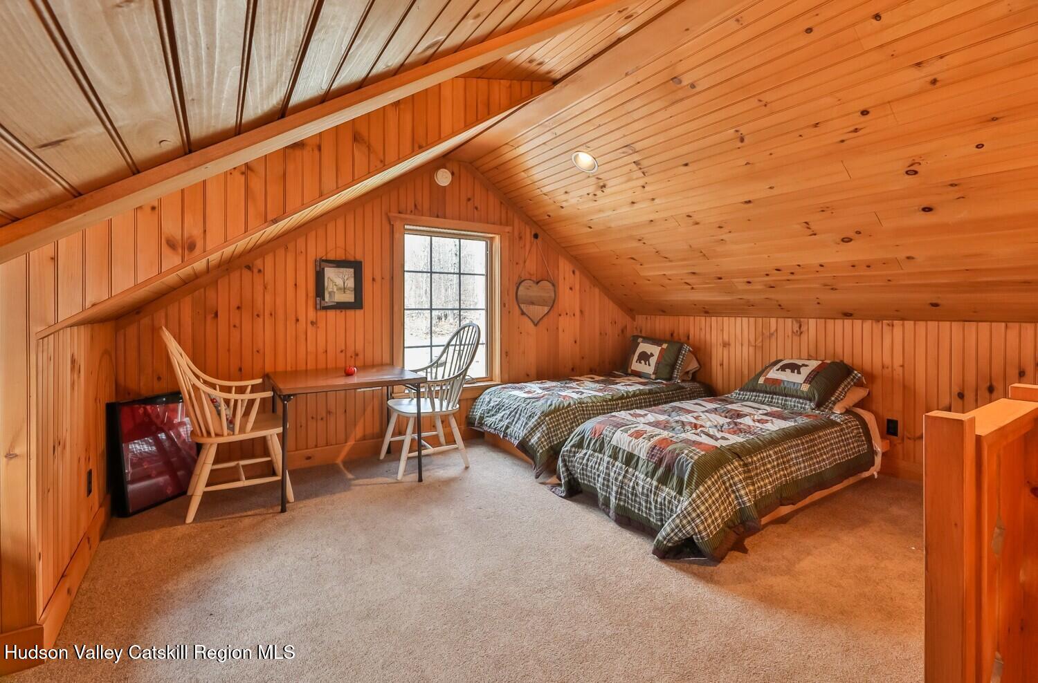 15 Hardwood Road West Kill, NY 12492 - Photo 39 of 53 a bed sitting in a room next to a window