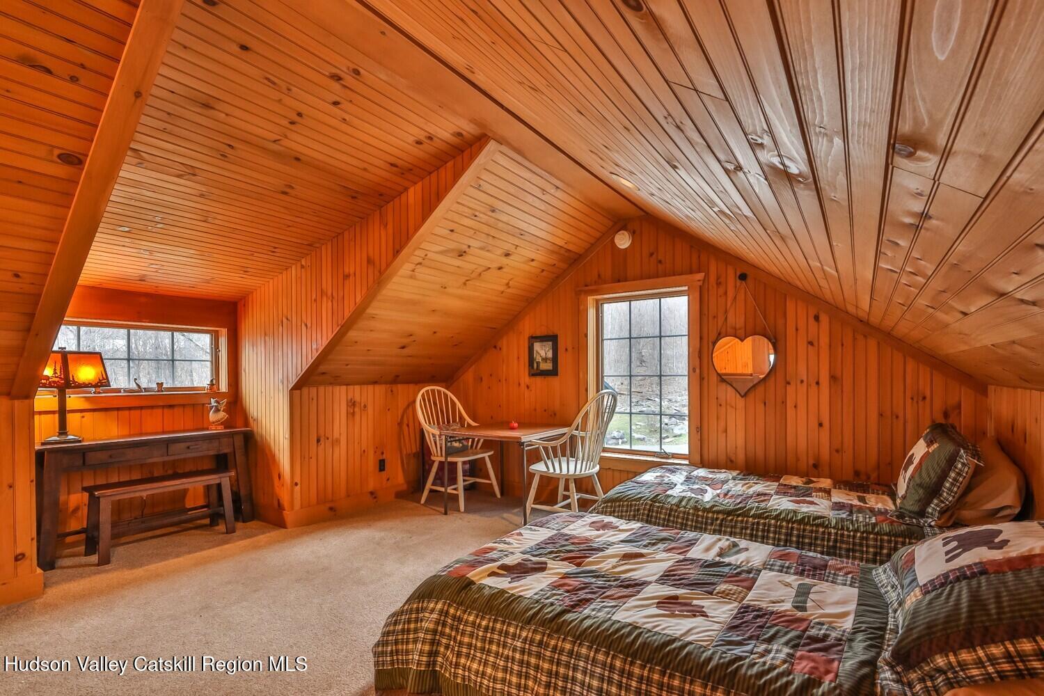 15 Hardwood Road West Kill, NY 12492 - Photo 40 of 53 a bedroom with a bed and wooden floor