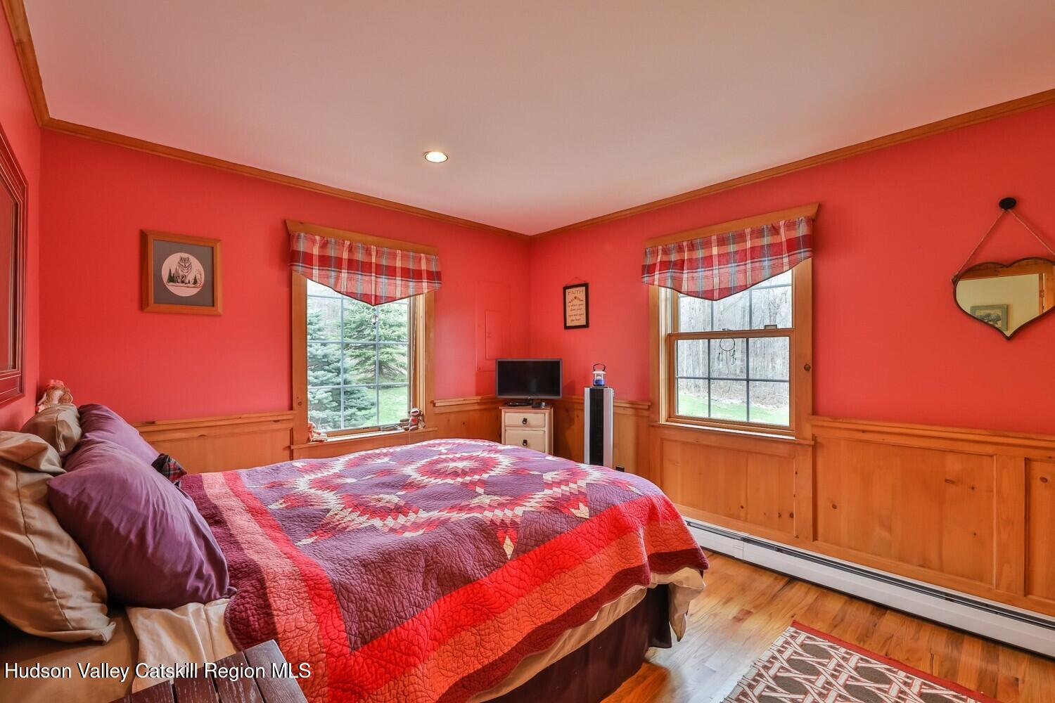 15 Hardwood Road West Kill, NY 12492 - Photo 43 of 53 a bed sitting in a bedroom next to a window