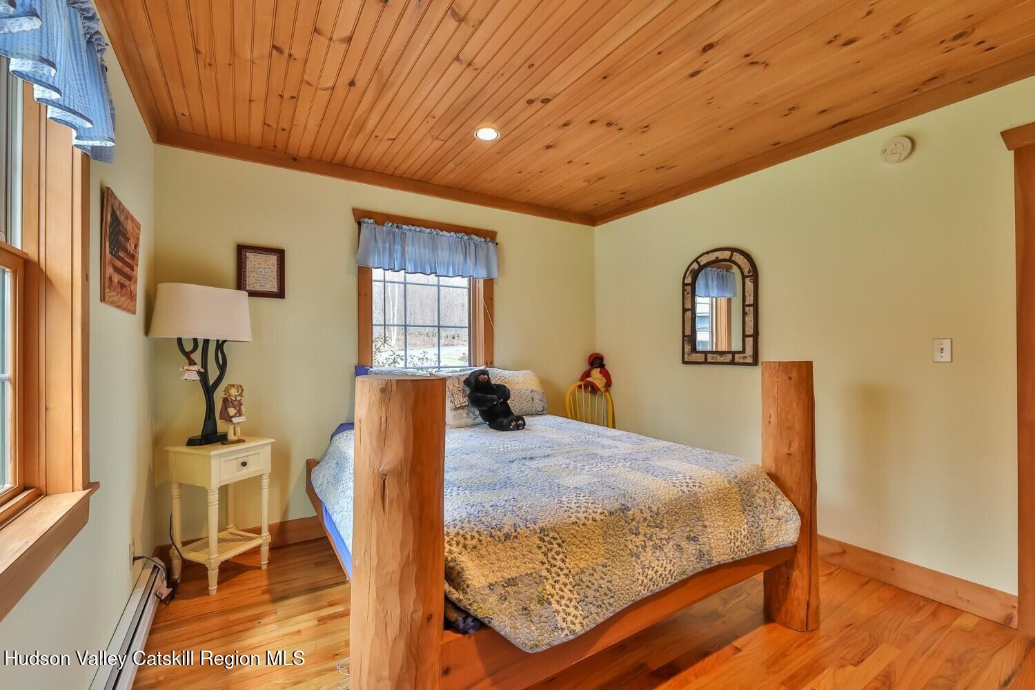 15 Hardwood Road West Kill, NY 12492 - Photo 45 of 53 a bedroom with a bed and wooden floor