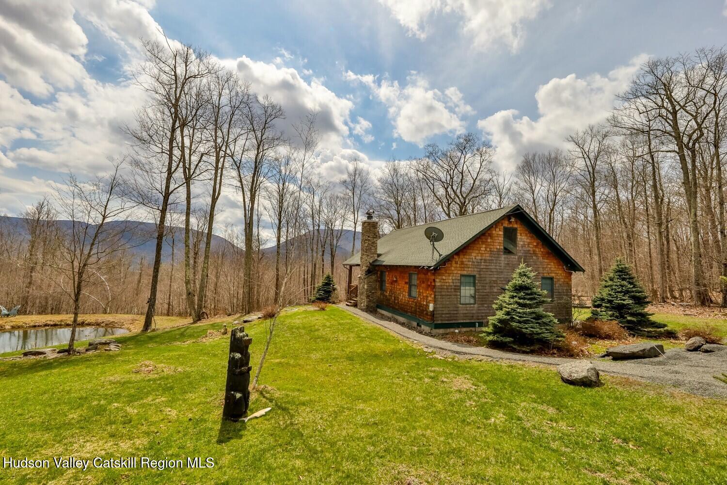 15 Hardwood Road West Kill, NY 12492 - Photo 7 of 53 a front view of a house with garden