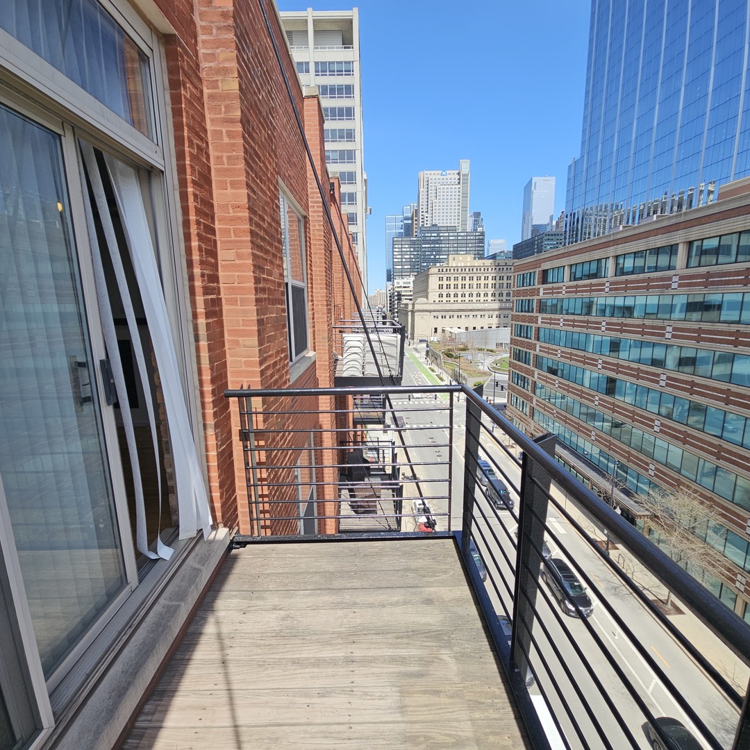 420 South Clinton Street, Unit 607 Chicago, IL 60607 - Photo 11 of 11 a view of balcony with wooden floor and staircase