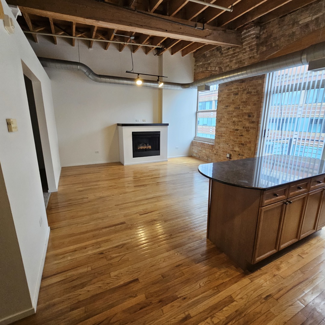 420 South Clinton Street, Unit 607 Chicago, IL 60607 - Photo 5 of 11 a view of livingroom with wooden floor