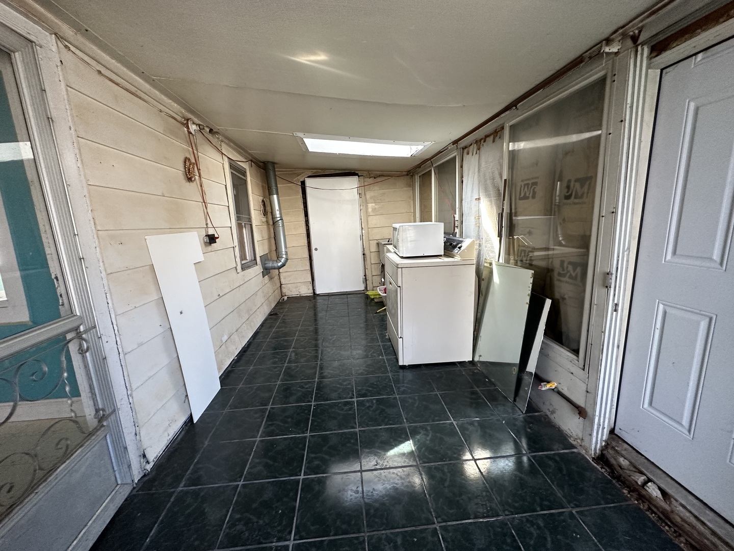 3622 Morgan Street Steger, IL 60475 - Photo 12 of 14 a view of a storage & utility room with fridge and wooden floor