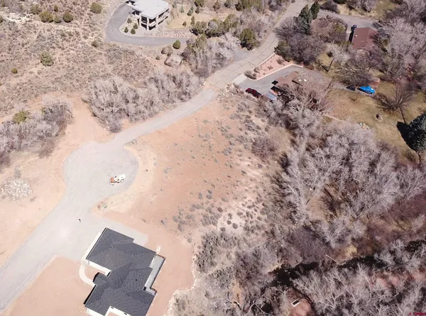 an aerial view of house with yard
