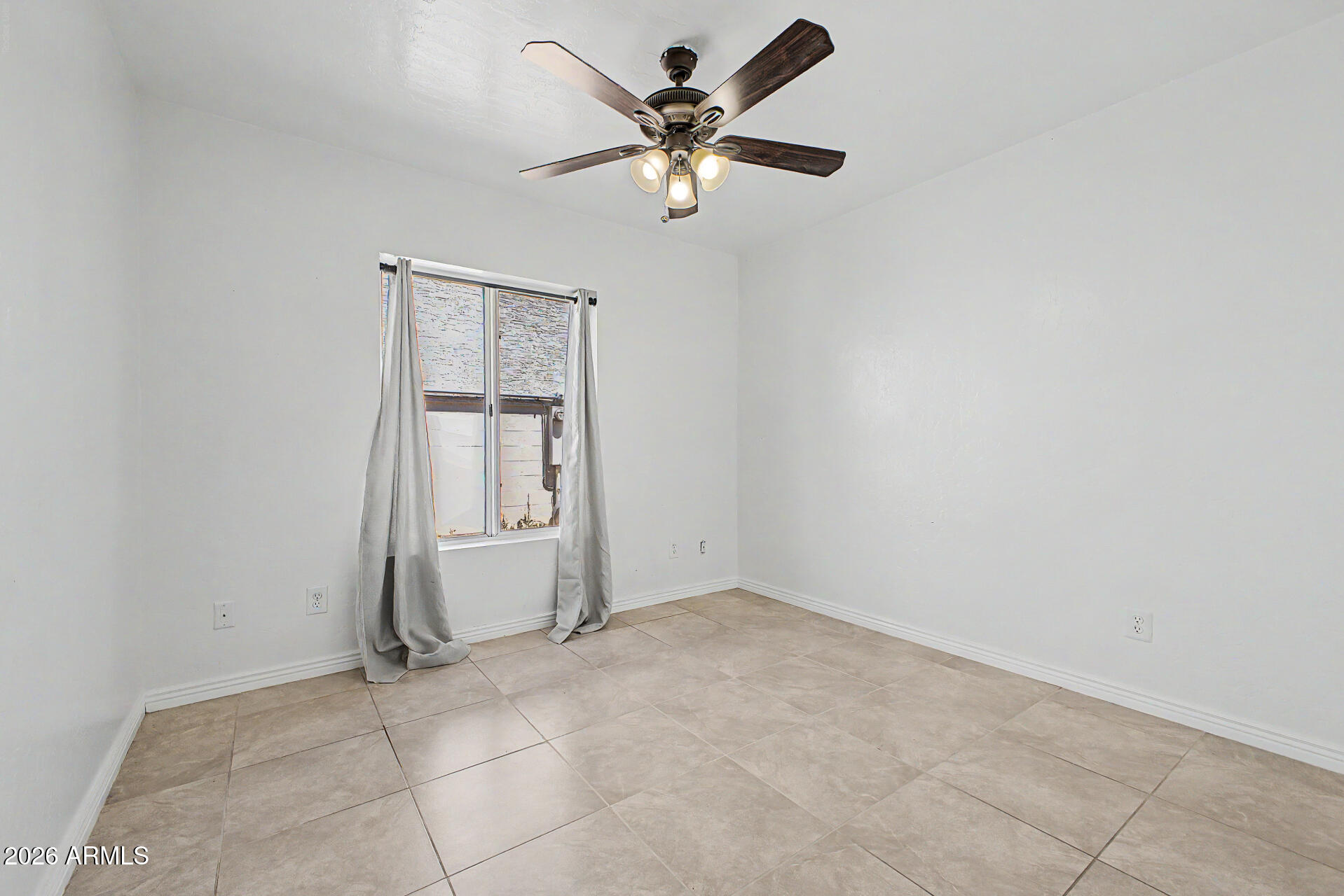 156 North Nielson Street Gilbert, AZ 85234 - Photo 22 of 32 an empty room with chandelier fan and windows