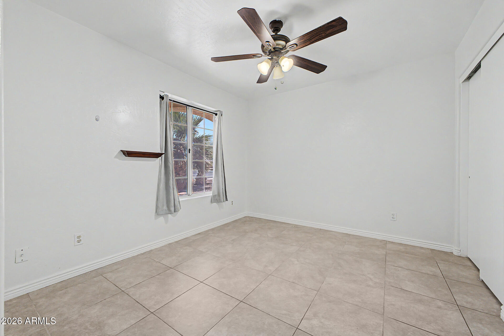 156 North Nielson Street Gilbert, AZ 85234 - Photo 24 of 32 an empty room with a window