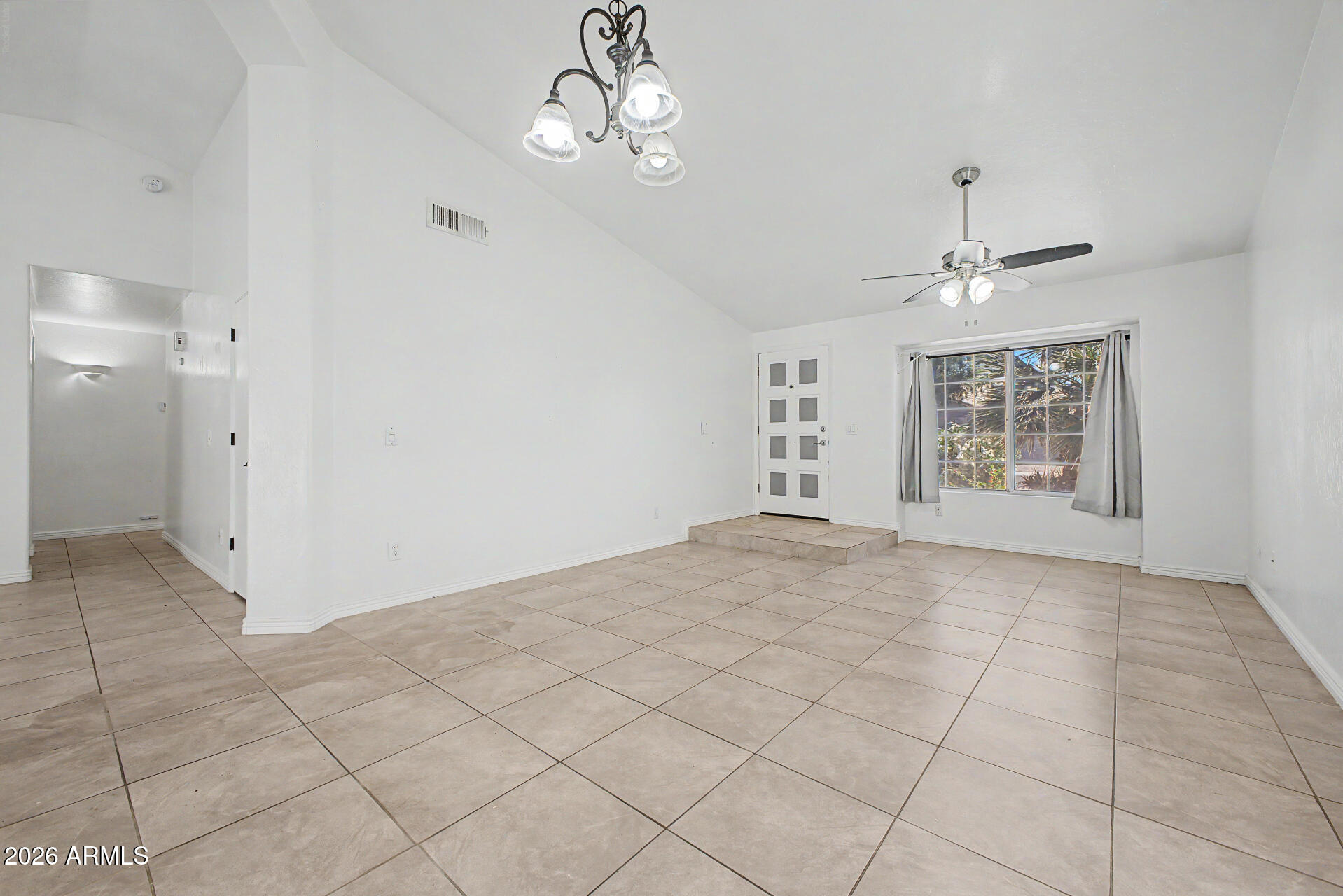 156 North Nielson Street Gilbert, AZ 85234 - Photo 4 of 32 a view of an empty room with a window