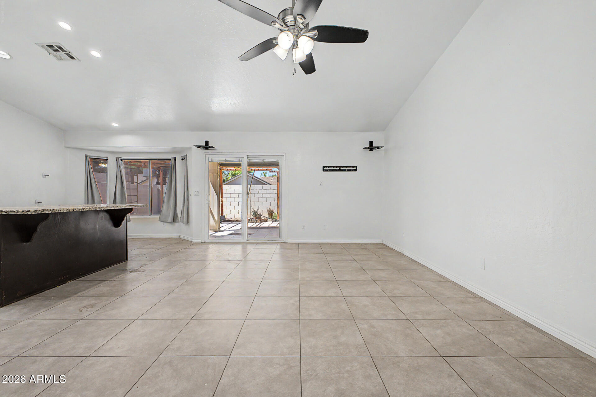 156 North Nielson Street Gilbert, AZ 85234 - Photo 7 of 32 a view of an empty room with a window