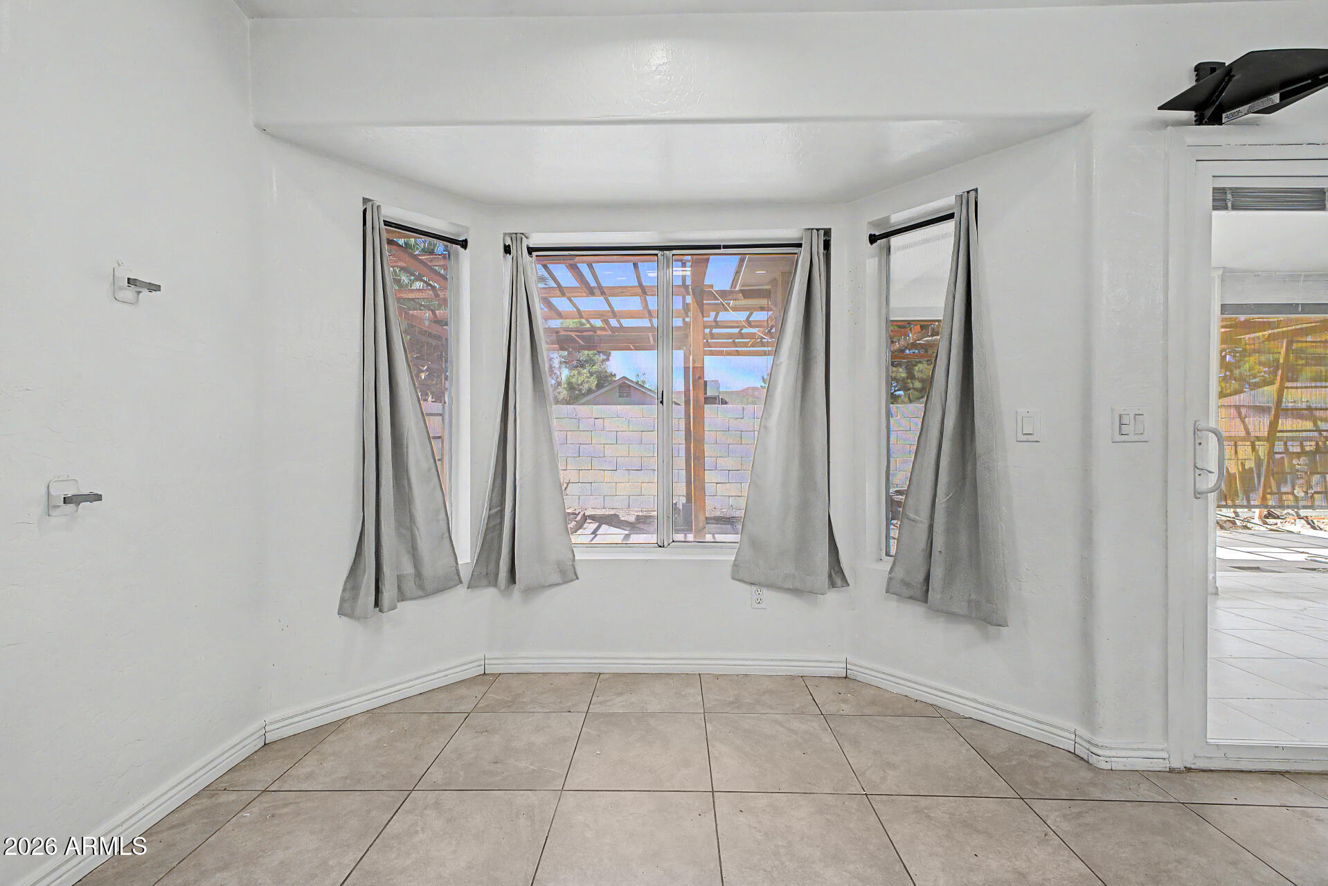 156 North Nielson Street Gilbert, AZ 85234 - Photo 9 of 32 a view of an empty room with a window