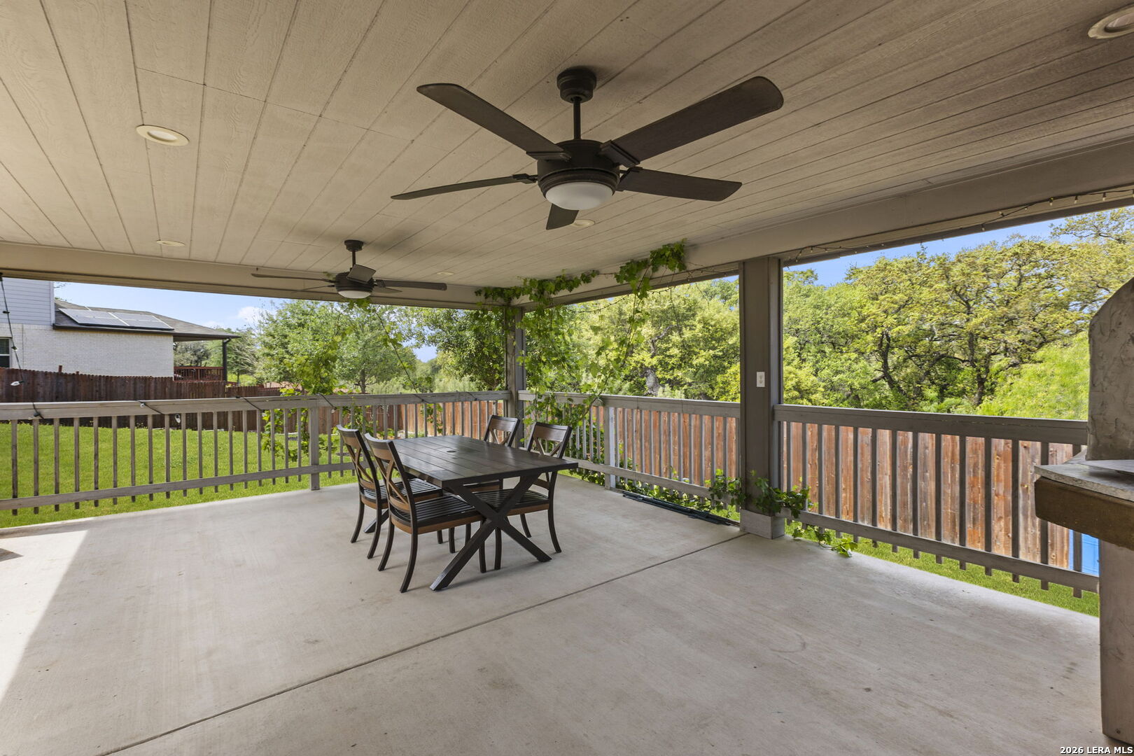 12221 Icon Ridge San Antonio, TX 78253 - Photo 32 of 46 a view of a patio with a table chairs and a floor to ceiling window