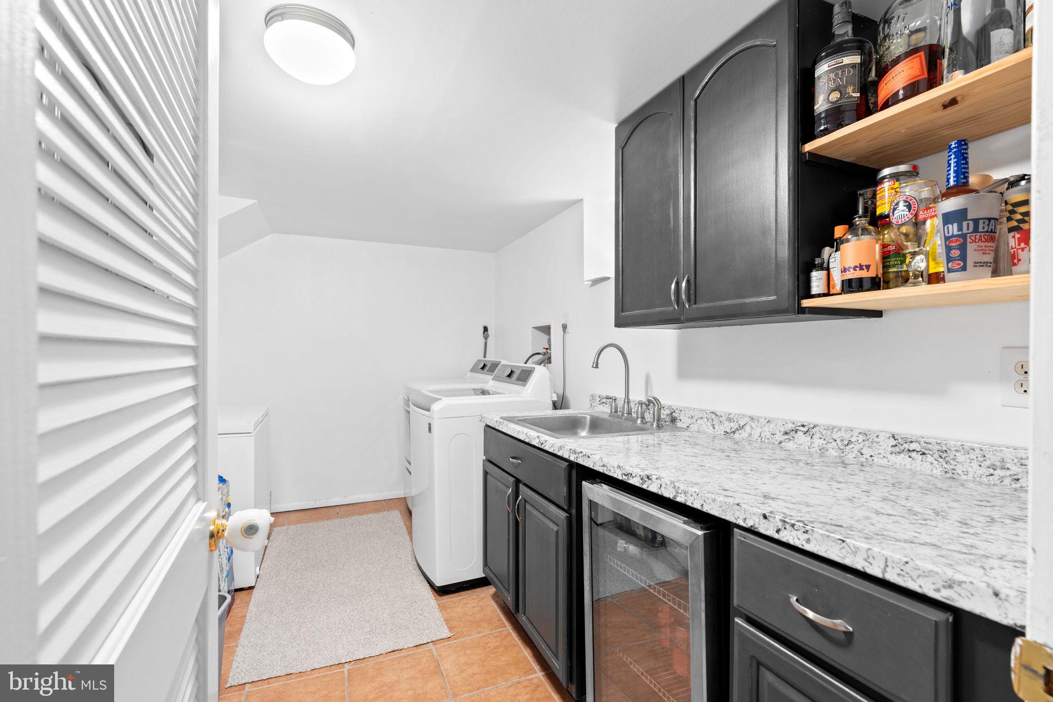 10310 Brunswick Avenue Silver Spring, MD 20902 - Photo 34 of 43 Stylish laundry room with modern finishes.