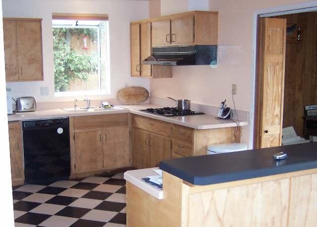 3935 Constellation Road Lompoc, CA 93436 - Photo 4 of 6 a kitchen with stainless steel appliances granite countertop a sink and cabinets