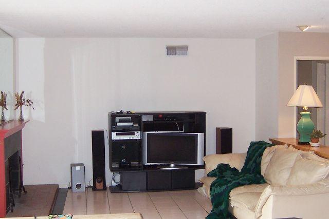 3935 Constellation Road Lompoc, CA 93436 - Photo 5 of 6 a living room with furniture and a flat screen tv