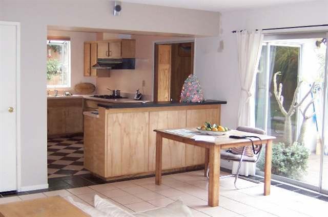 3935 Constellation Road Lompoc, CA 93436 - Photo 6 of 6 a kitchen with stainless steel appliances a table and chairs in it