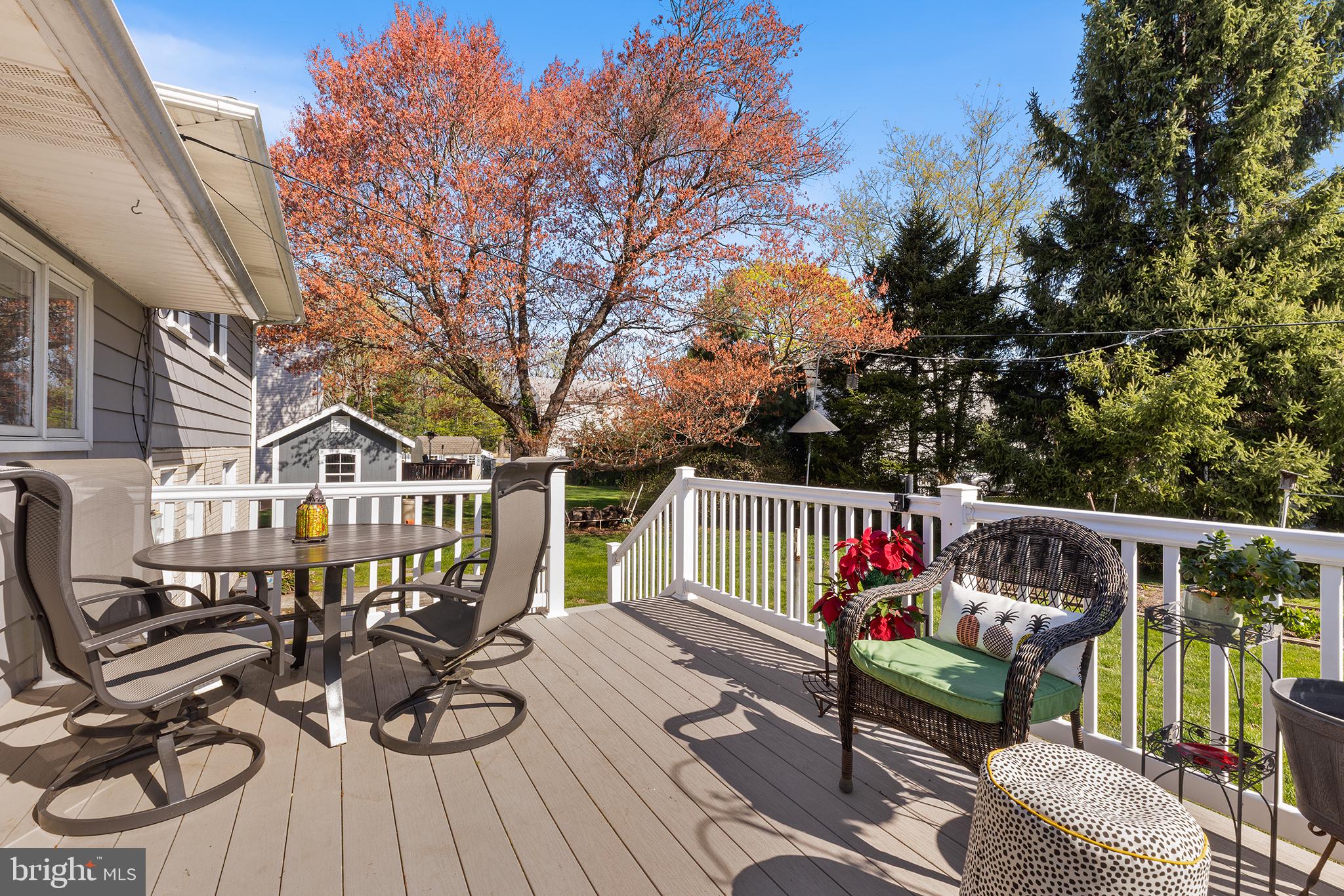 331 North Lehigh Circle Swarthmore, PA 19081 - Photo 28 of 32 a view of a roof deck with couches and potted plants with wooden floor and fence
