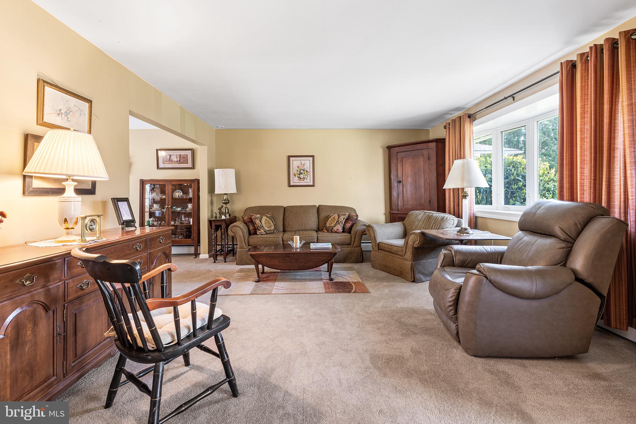 331 North Lehigh Circle Swarthmore, PA 19081 - Photo 4 of 32 a living room with furniture two windows and a dining table